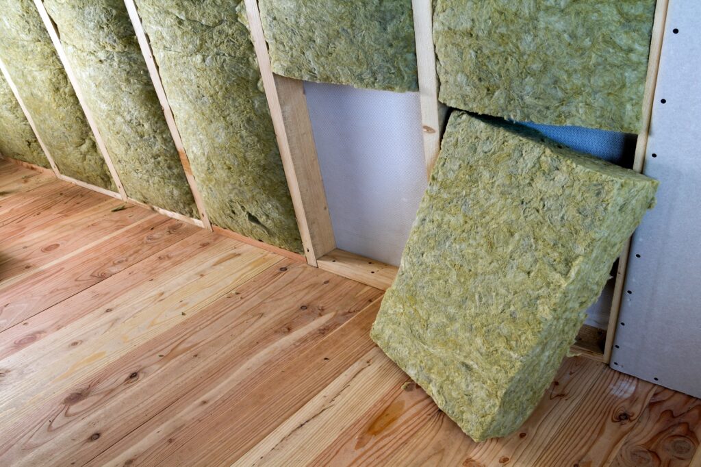 Wooden frame for future walls with drywall plates insulated with rock wool